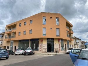 residential building with a cafe on the ground floor